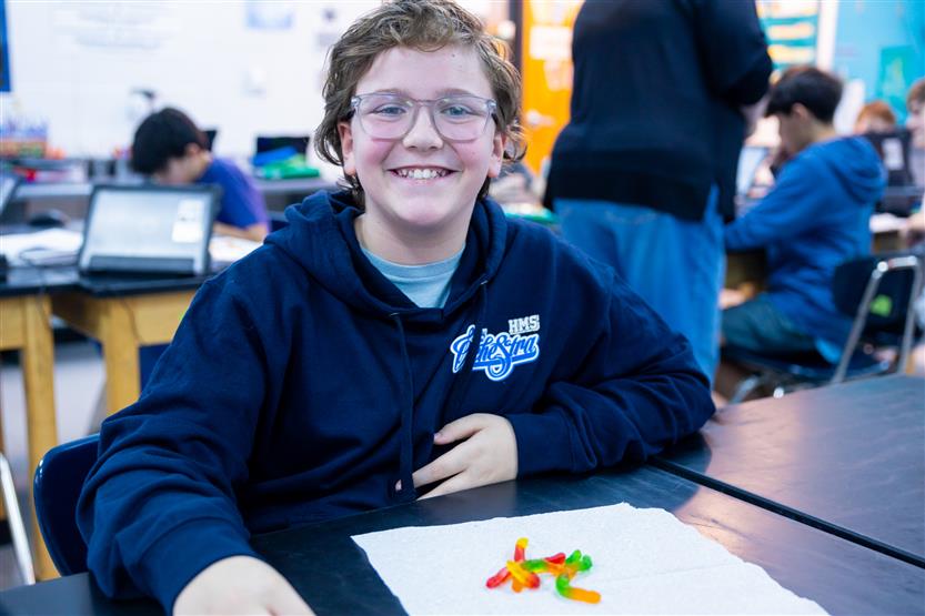 Middle school students in science class